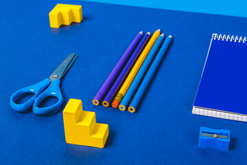 school supplies on blue background