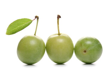 Wild green plums isolated on white background