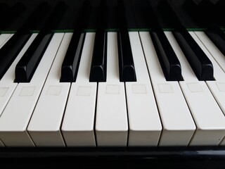 black and white piano keys with white sticker