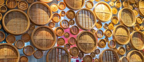 Bamboo dumpling lids in a window of a dumpling shop in Sydney CBD