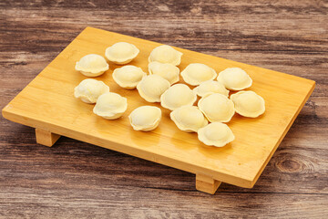Fototapeta na wymiar Raw dumplings over board for cooking