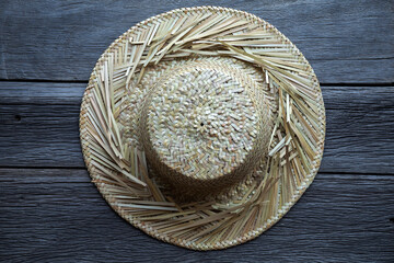 Straw hat on the wooden surface