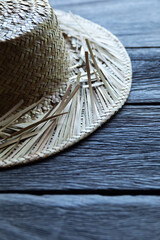 Straw hat on the wooden surface