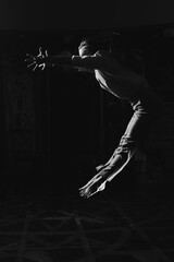 Black and white portrait of beautiful dancing caucasian girl with dramatical emotion on the...