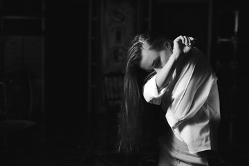 Black and white portrait of beautiful dancing caucasian girl with dramatical emotion on the...