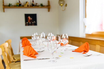 charming and warm table and place settings interior shot of a restaurant table