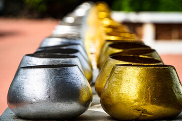 coin in monk's bowl or almsbowl.A lot of monk's bowl or alms bowl in the Buddhism temple Chiangmai,...