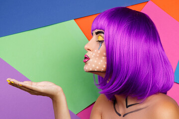 Model in creative image with pop art makeup