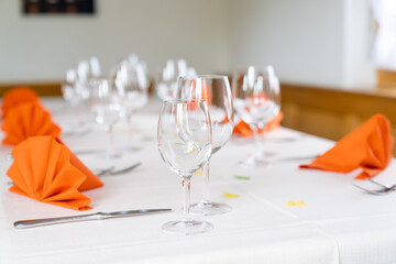 charming and warm table and place settings interior shot of a restaurant table