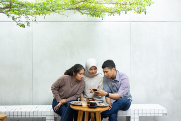 having fun with friends on cafe enjoy using smartphone