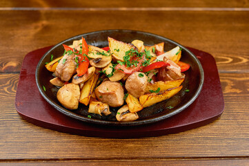 A plate of food on a wooden table