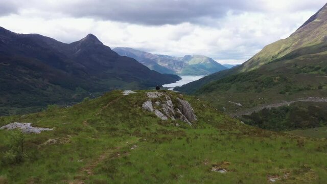 aerial footage of loch leven and the pap of glencoe shot on the west highland way near kinlochleven in the argyll region of the highlands of scotland in summer