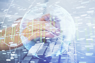 Double exposure of businessman working on laptop on background. International business hologram in front. Concept of success.