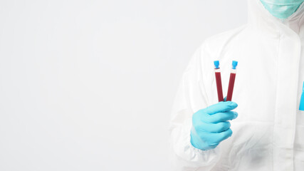 Male with PPE cloth and Hand wearing doctor glove is holding blood collection tube on white...