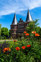 Lübeck Holstentor(Holstengate) with flowers in the foreground