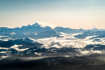 Sunrise over Mont Blanc mountain range from a plane above french alps