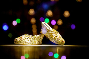 bride sandal with reflection colourful bokeh