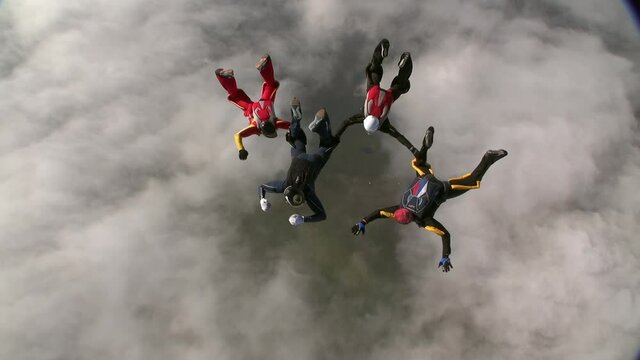Sports parachutist build a figure in free fall. Extreme sport concept.