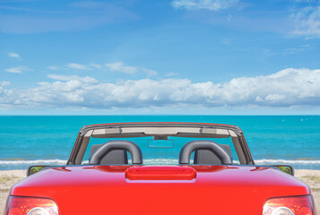 Red car on the beach. Vacation and freedom concept.