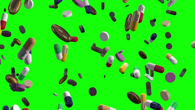 Assorted Colorful Pills Raining on Green Alpha
