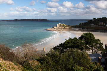 Sunny and empty beach at Perros-Guirec in northern France.
