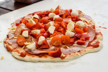 Making of homemade Italian pizza in fireplace brick oven.