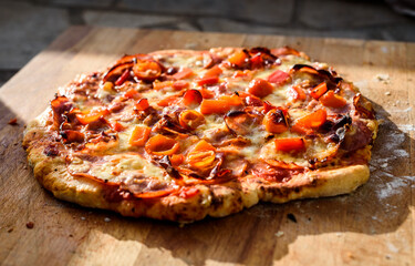 Making of homemade Italian pizza in fireplace brick oven.