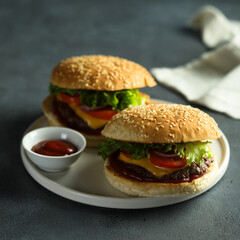 Homemade cheeseburgers on a white plate