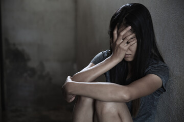 Human trafficking of women, a woman sitting on ground, Sexual violence , sexual abuse and rape.