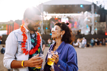 Couple with beer at music festival.  Summer Beach party, holiday, vacation concept.