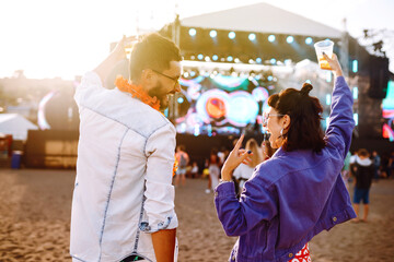 Couple with beer at music festival.  Summer Beach party, holiday, vacation concept.