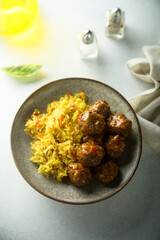 Homemade meatballs with spicy rice