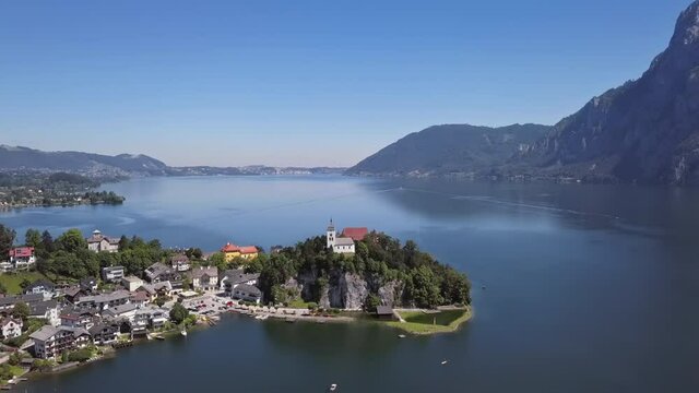 Flight around of Traunkirchen church on Traunsee lake, in Salzkammergut, Upper Austria.