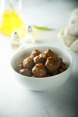 Homemade meatballs in a white bowl
