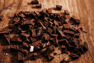 Broken chocolate. Milk and dark chocolate Closeup photo.

