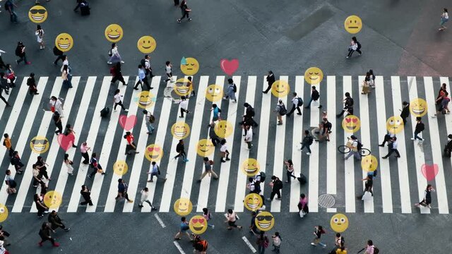 Aerial view of pedestrians walk at Shibuya Crossing. Emojis of people. Technology science concept.