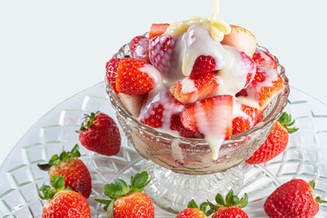 Arrangement with beautiArrangement with beautiful strawberries and condensed milk and accessories