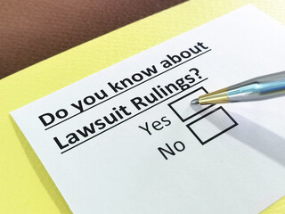 Obraz premium One person is answering question about lawsuit rulings.