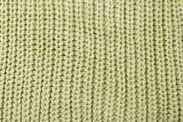 texture of woolen knitted fabric, vertical pattern, green color