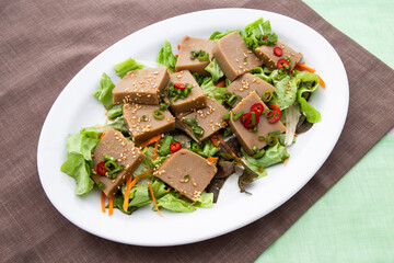 Seasoned Acorn Jelly Salad which is called Muk made of buckwheat
