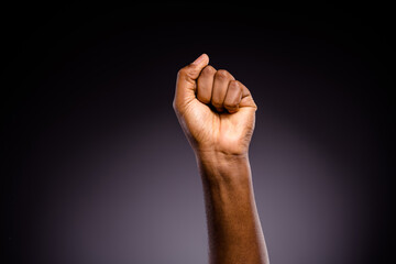 Close up photo of afro american hand raise fists ask support african community stop discrimination...