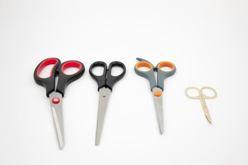 different color and size scissors on a white background