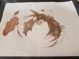 dirty brown napkin with chocolate stains or drips