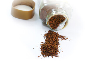 Instant coffee with a bottle on white background