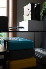 Internal hard disk drive docking station in home office & coloured cases for protection.