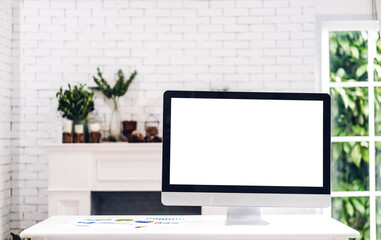 Creative desktop computer with white mockup blank screens on table in modern minimal white work loft