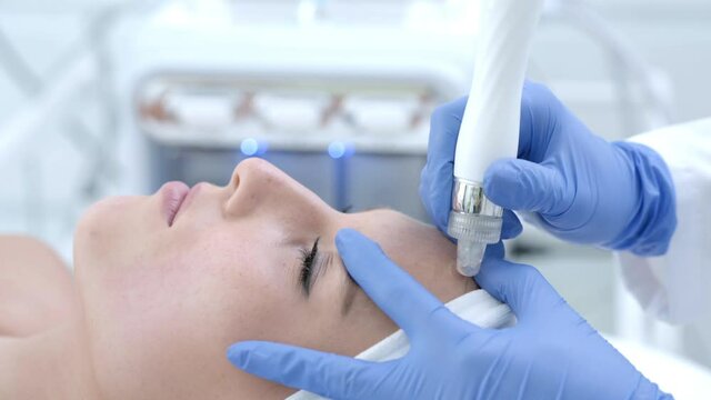 Close-up 4K video of woman enjoying beauty treatment in professional salon