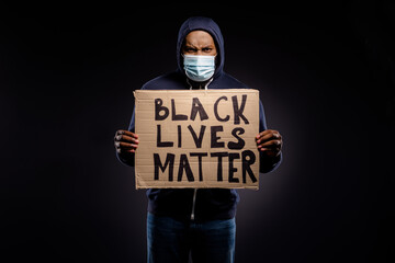 Photo of furious angry afro american guy medical mask human african people discrimination society...