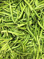 a bunch of green beans in vegetable market