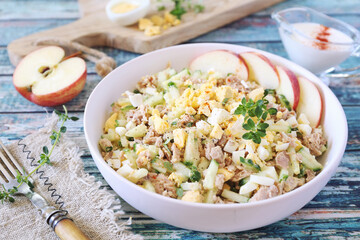 Tuna salad with cucumber, eggs and spicy sauce